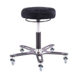 Synetik Omnistool welding stool with black round seat, industrial steel base and five rubber casters.