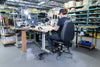 Synetik SF190 Vinyl chair in use at a sewing workstation