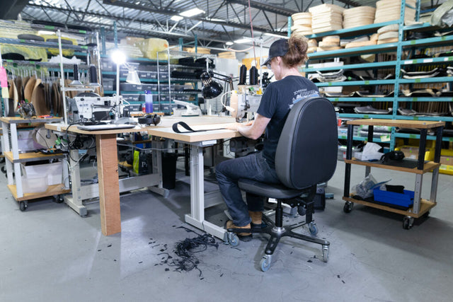 Synetik SF190 Vinyl chair in use at a sewing workstation