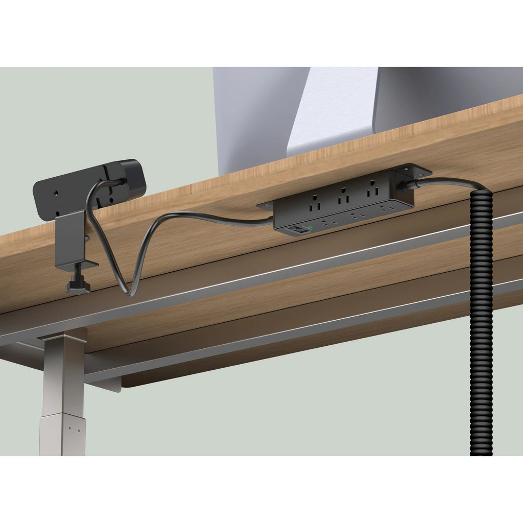 Black Workstation Power Combo installed on a desk with a coiled power cord