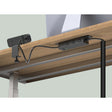 Black Workstation Power Combo installed on a desk with a coiled power cord